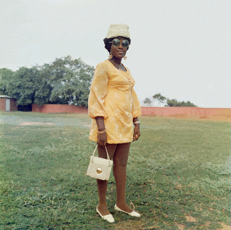 Figure 18. James Barnor, A wedding guest in the park behind Holy Trinity Cathedral, Accra, around 1971 